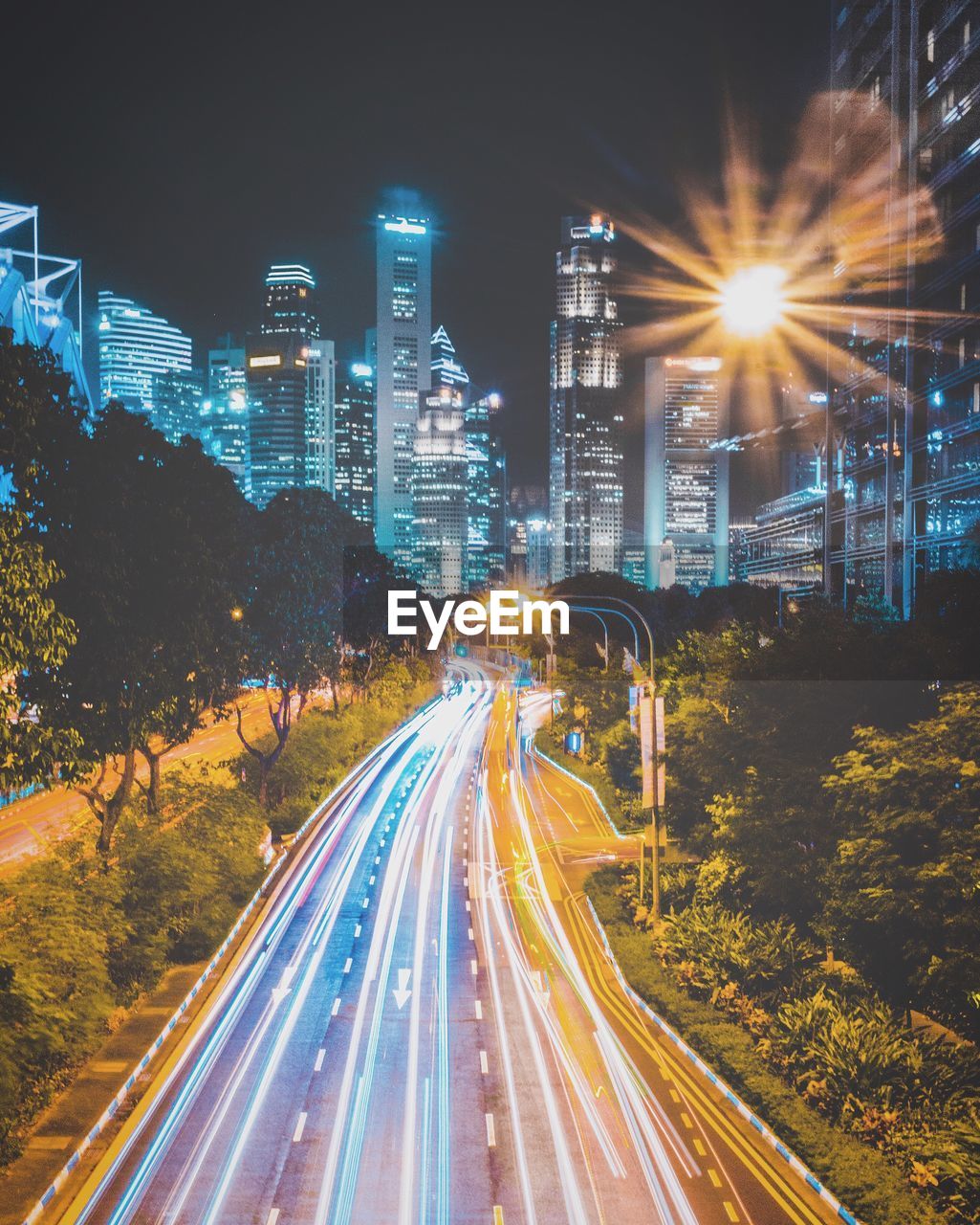 Light trails on road in city at night