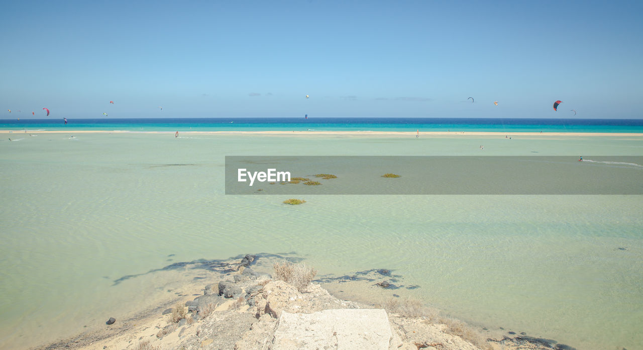 Scenic view of beach against clear sky