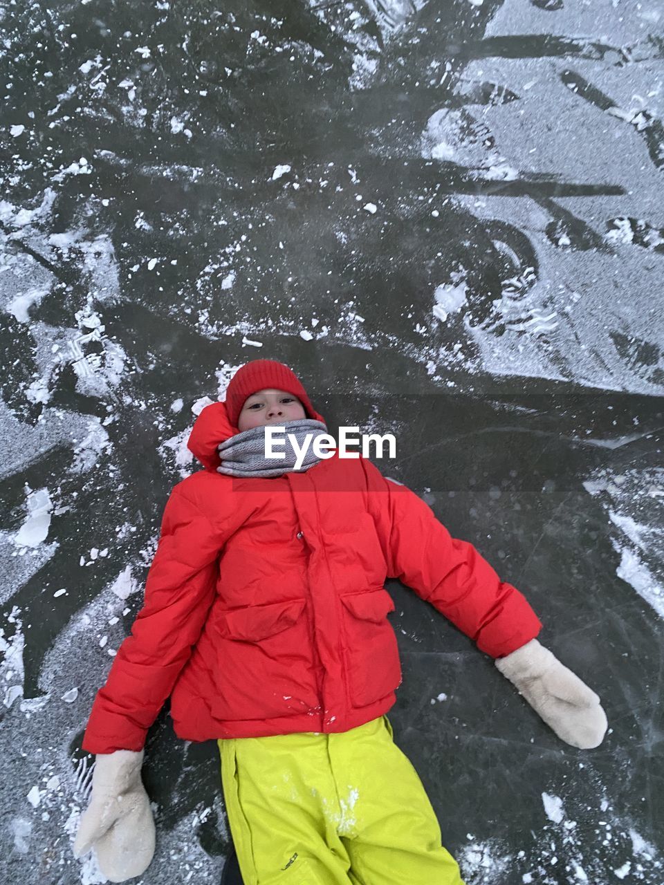 Low section of woman standing on snow