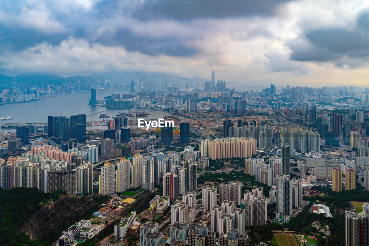 High angle view of modern buildings in city against sky