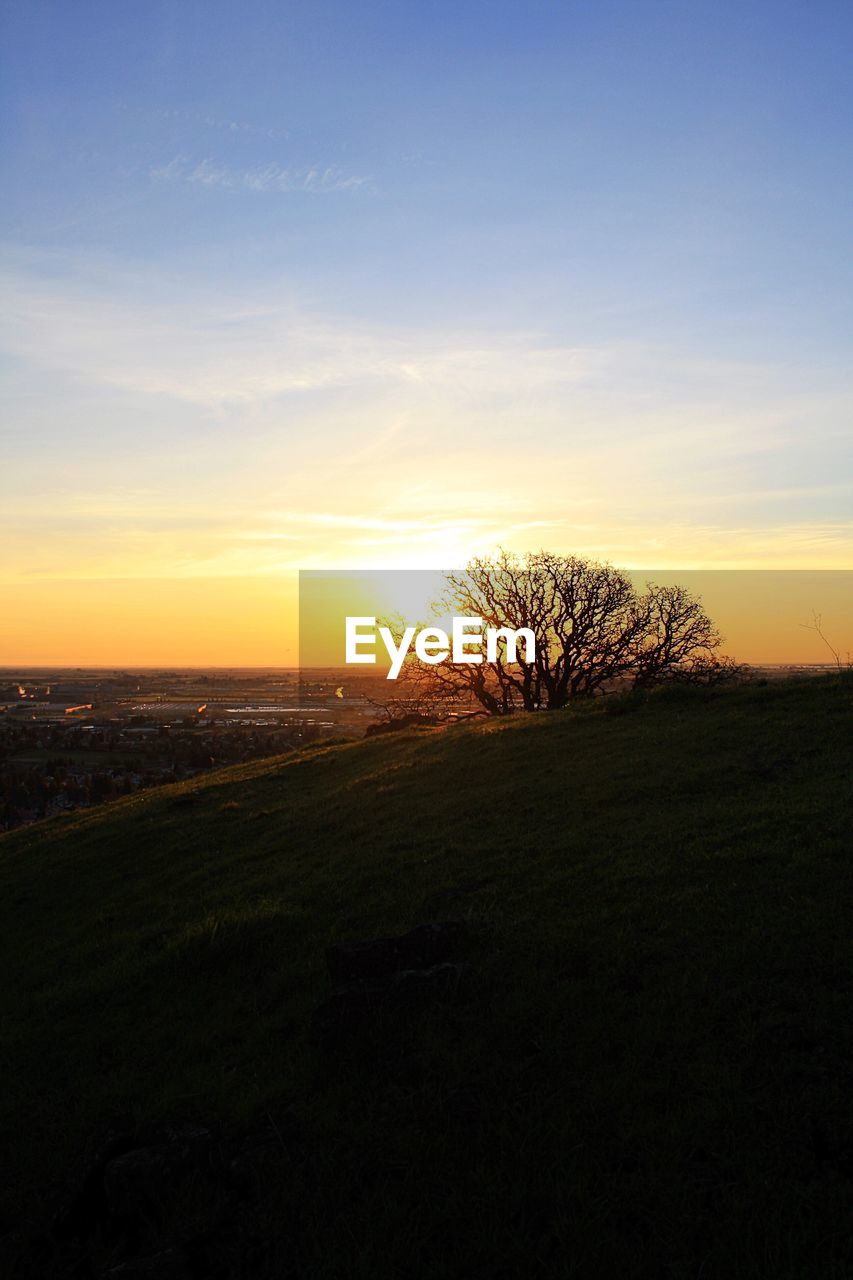 Scenic view of sunset over landscape