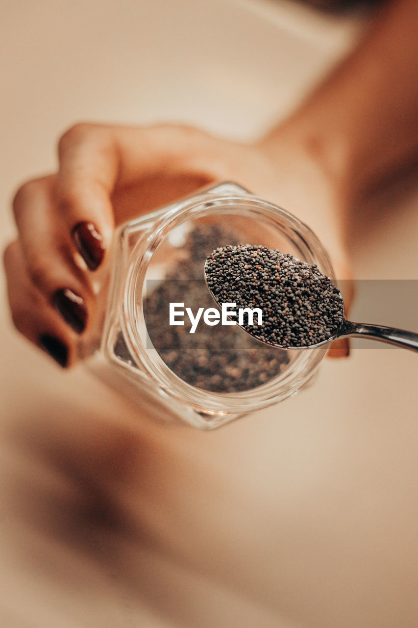 Close-up of woman holding seeds