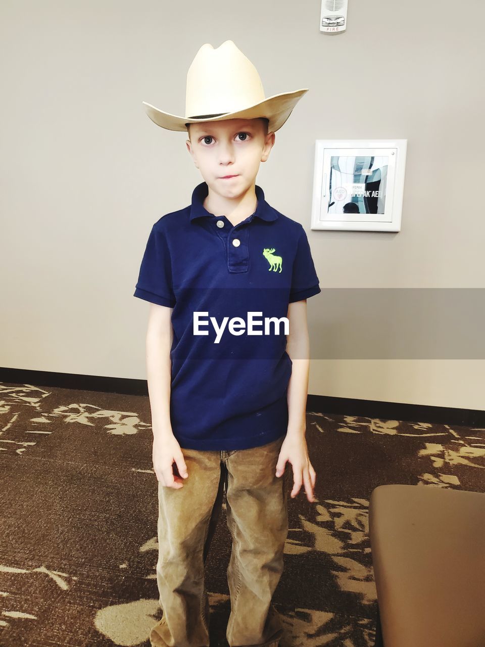 childhood, child, one person, men, cowboy hat, hat, portrait, standing, clothing, looking at camera, indoors, full length, fashion accessory, fedora, front view, sun hat, white, dressing up, spring, costume, toddler, cowboy, cute, emotion, casual clothing, fun