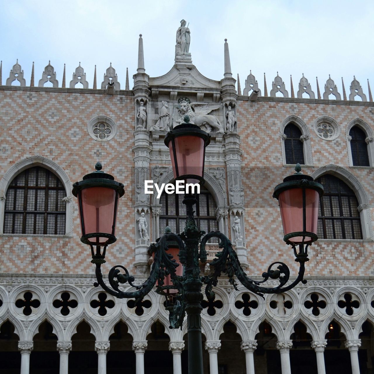 Antique street light against doges palace