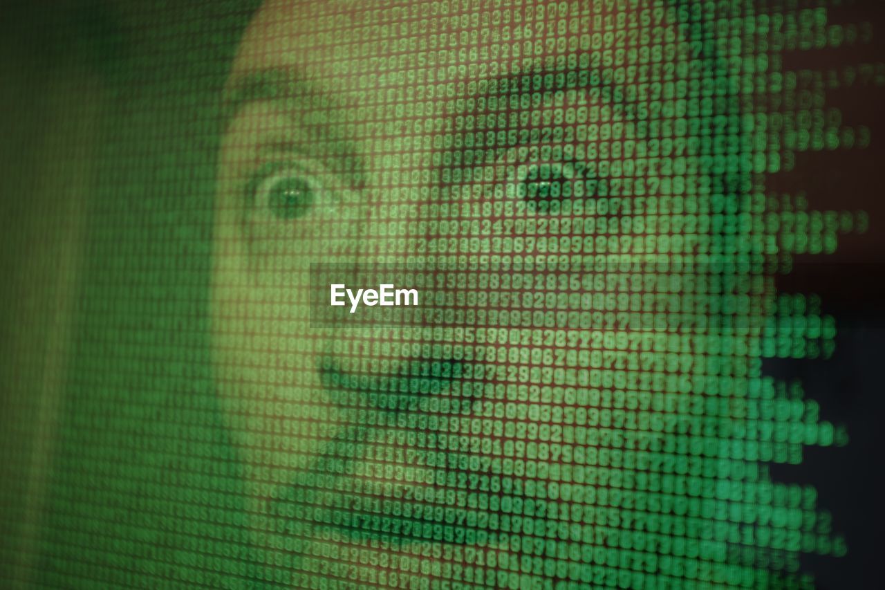 Digital composite image of shocked man looking away against computer language