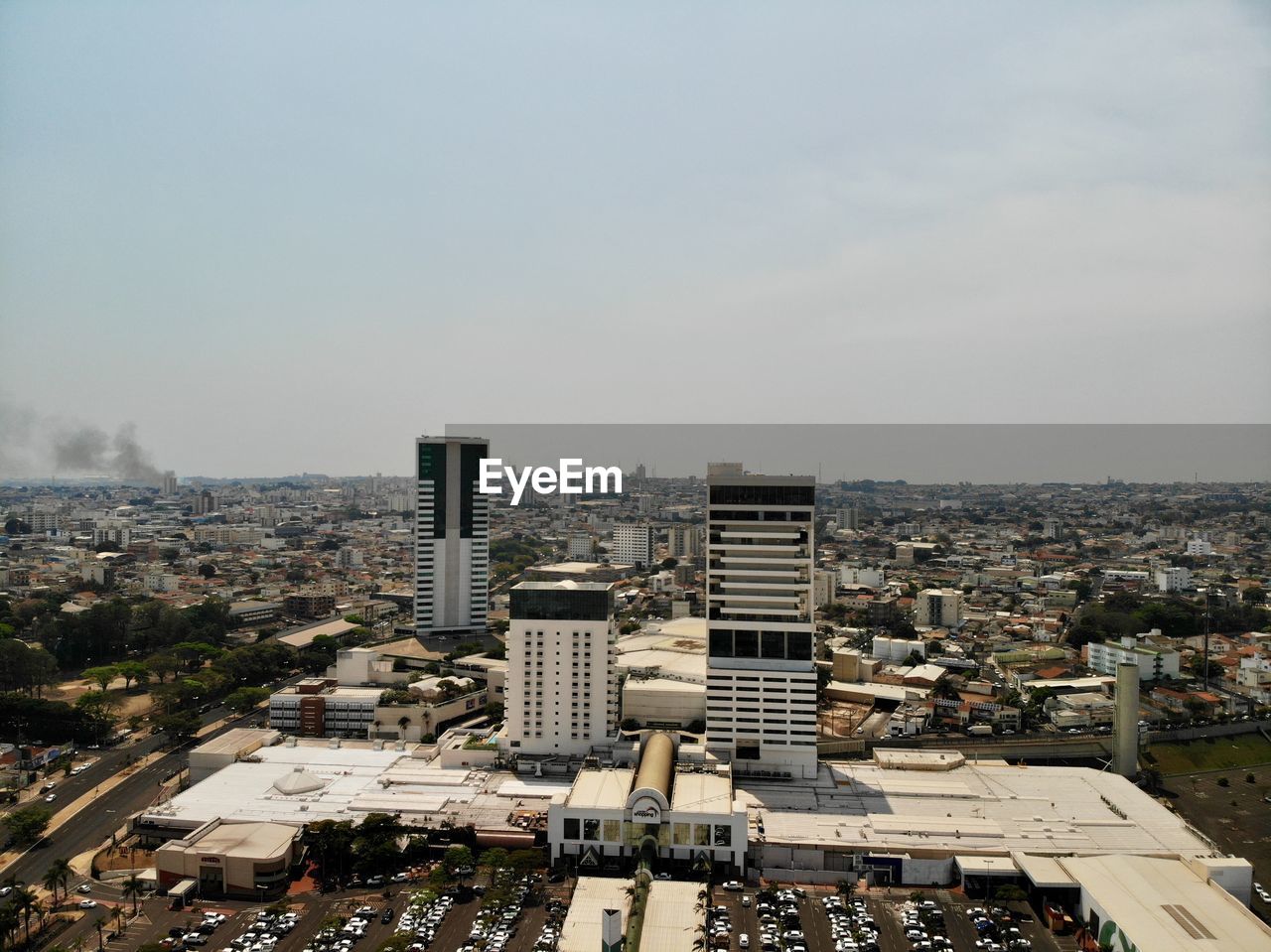 High angle view of buildings in city against sky