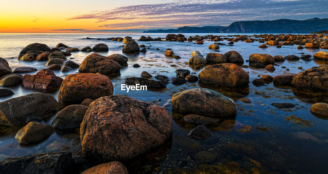 Scenic view of sea against sky during sunset