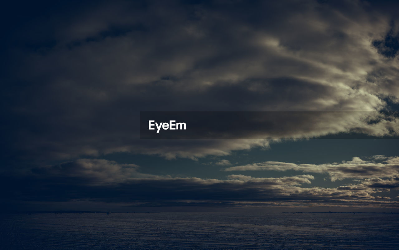 sky, cloud, beauty in nature, horizon, water, scenics - nature, sea, nature, tranquility, dramatic sky, darkness, cloudscape, ocean, storm, no people, tranquil scene, environment, sunlight, dusk, horizon over water, outdoors, reflection, overcast, sunset, storm cloud, idyllic, evening, seascape, awe, dark, light