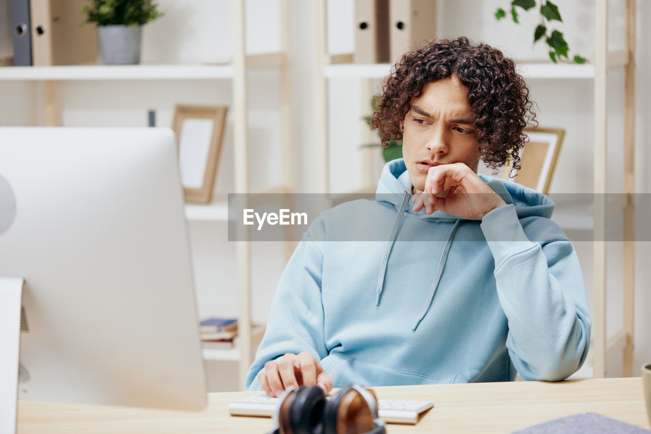 Worried businessman working at home