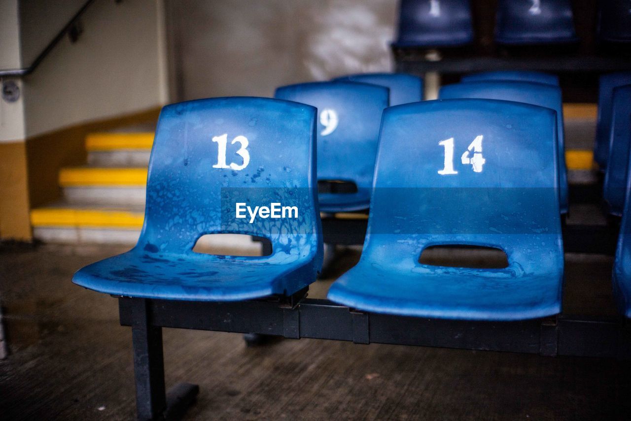 Close-up of numbers on empty seats