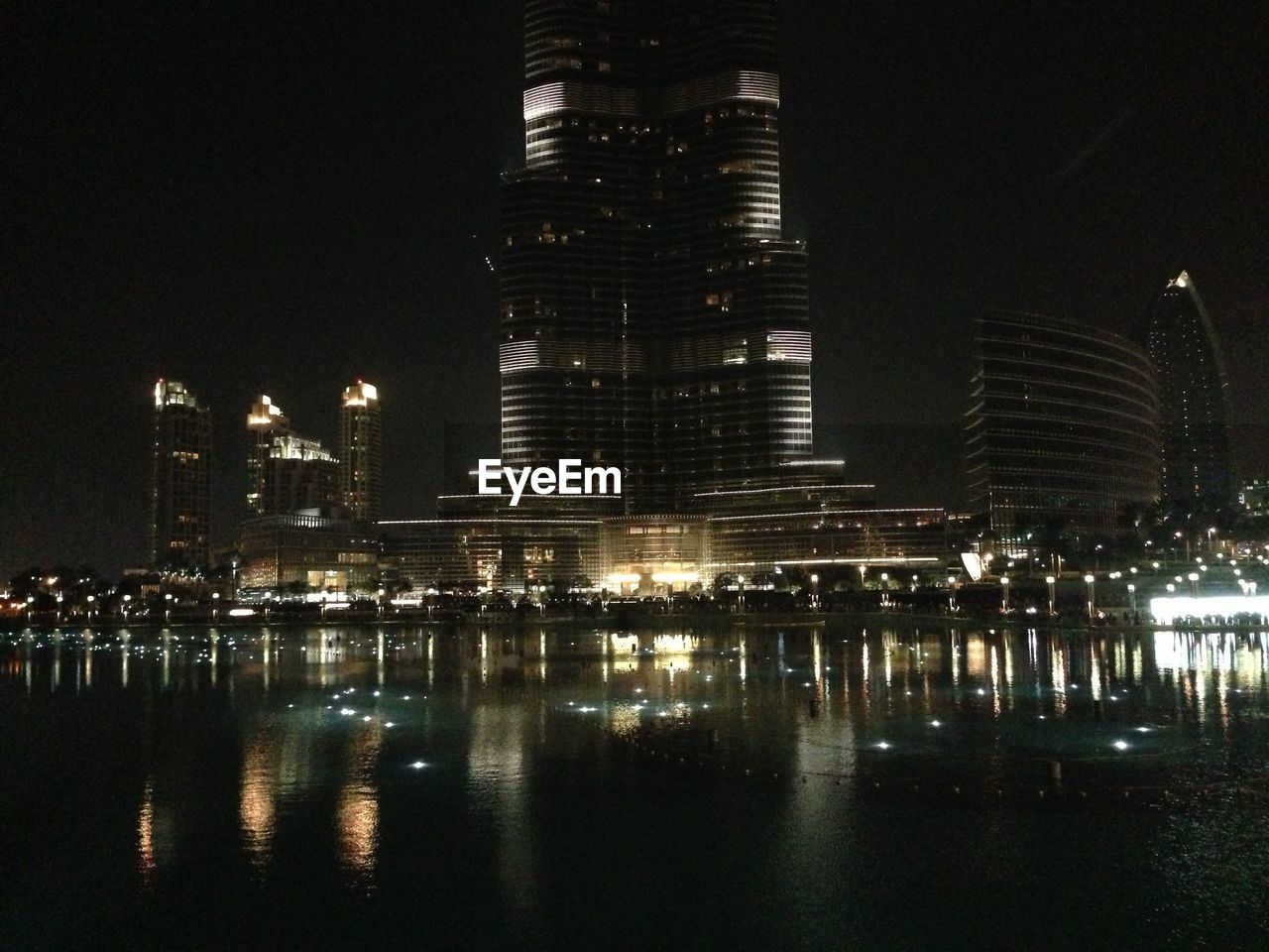 ILLUMINATED CITYSCAPE AT NIGHT