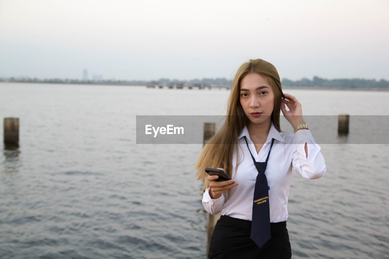 Portrait of sailor against sea