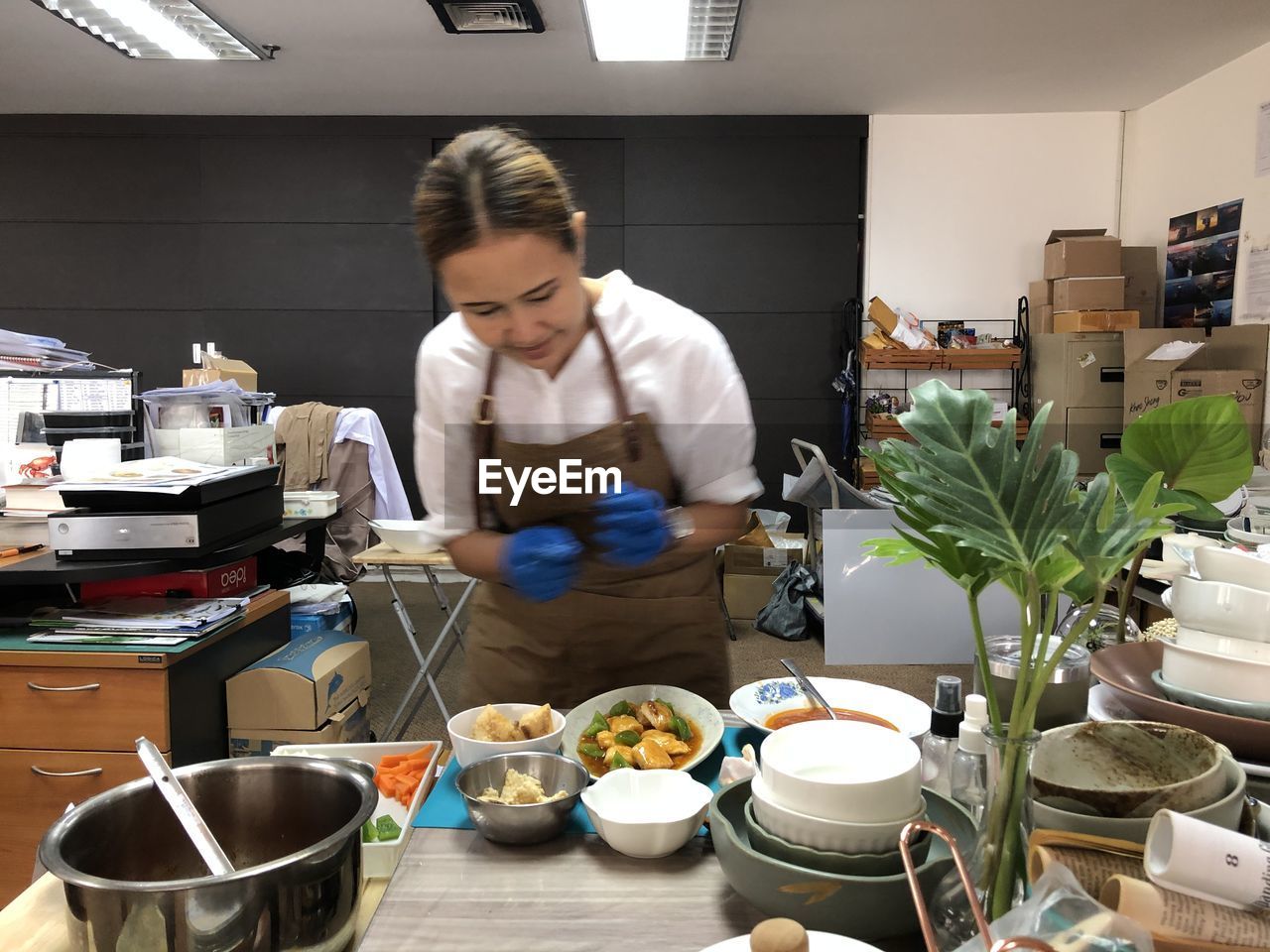 MID ADULT WOMAN HAVING FOOD