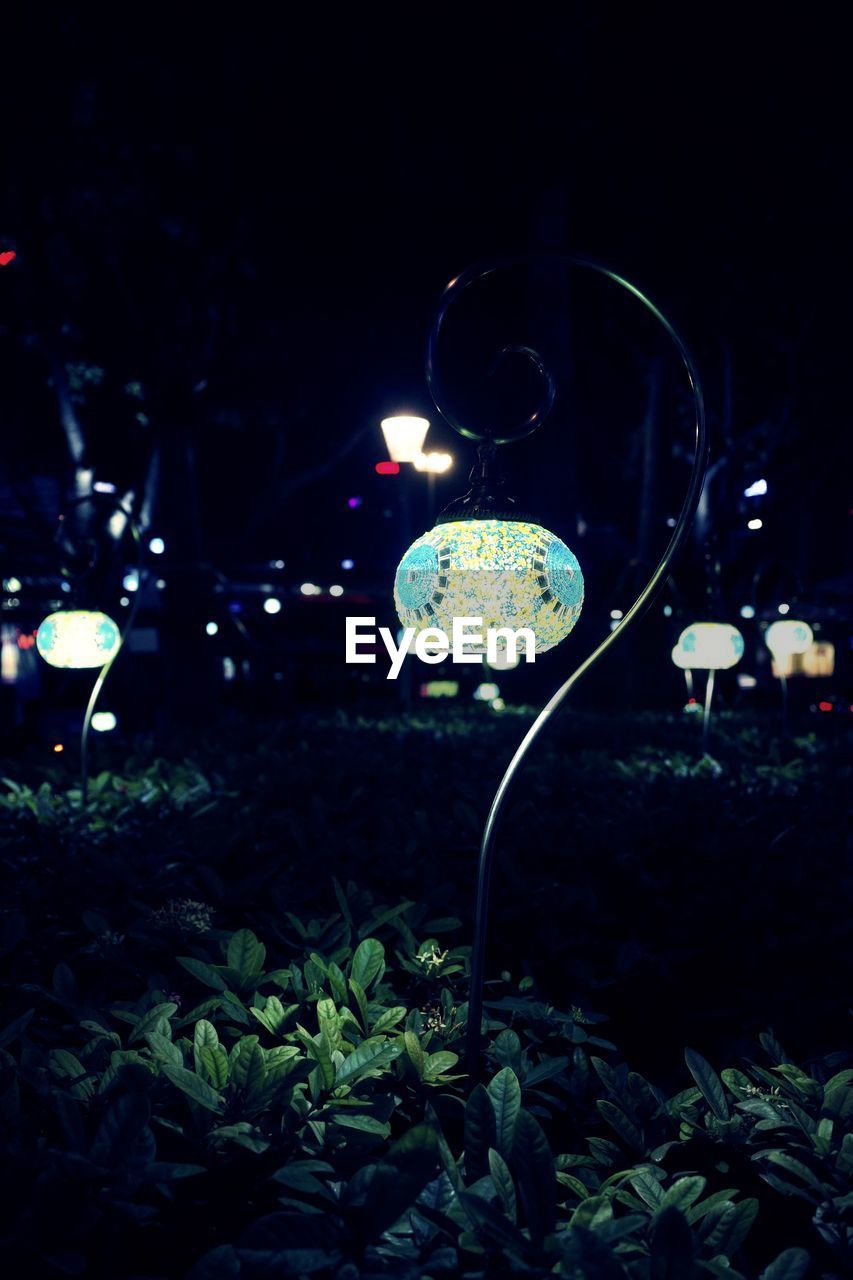 CLOSE-UP OF ILLUMINATED LIGHTING EQUIPMENT