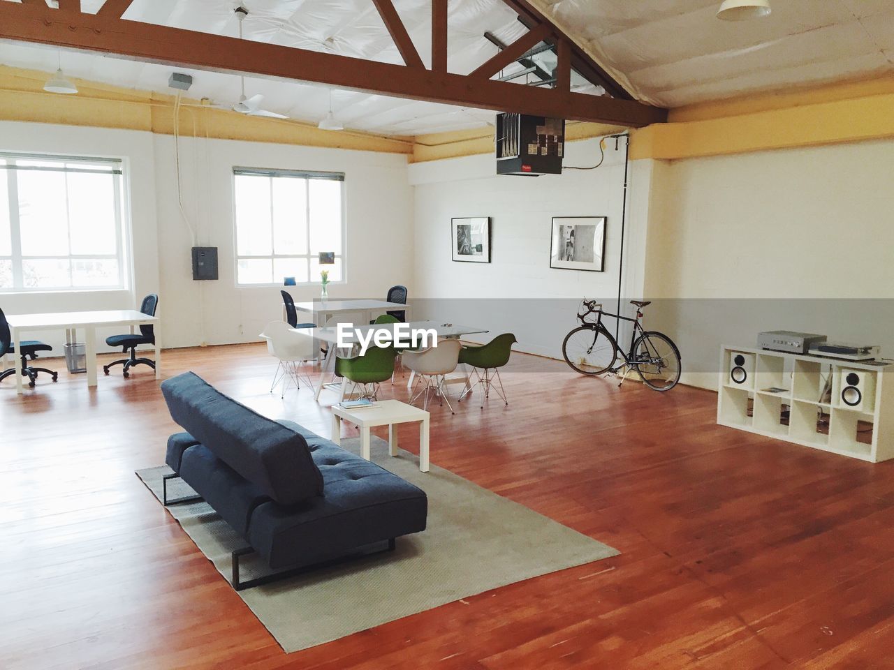 View of empty large room with furniture and bicycle