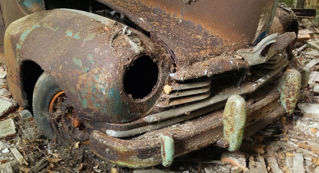 CLOSE-UP OF ABANDONED CAR