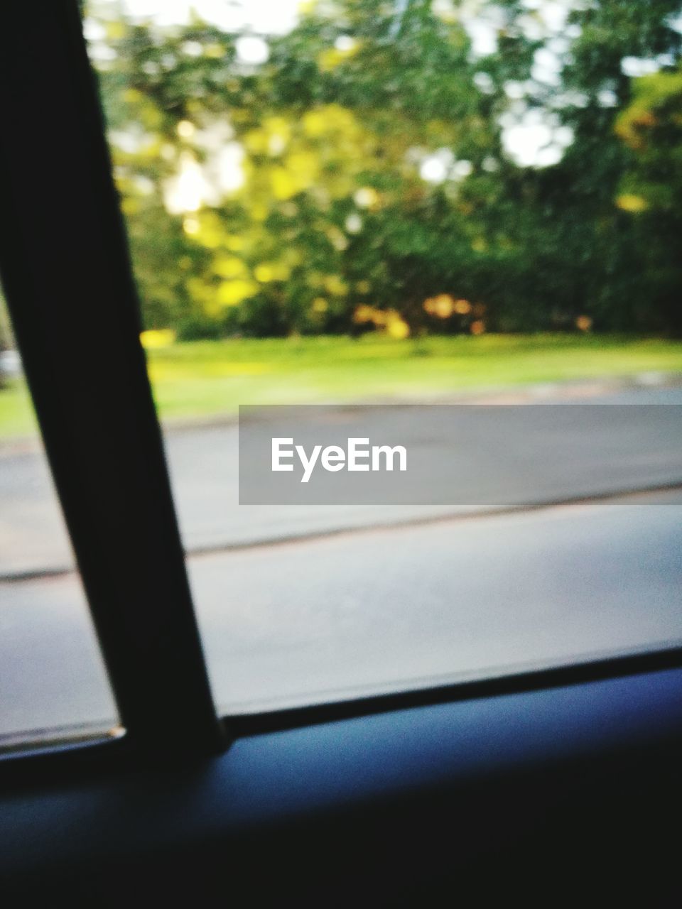 CLOSE-UP OF CAR WINDOW IN BUS