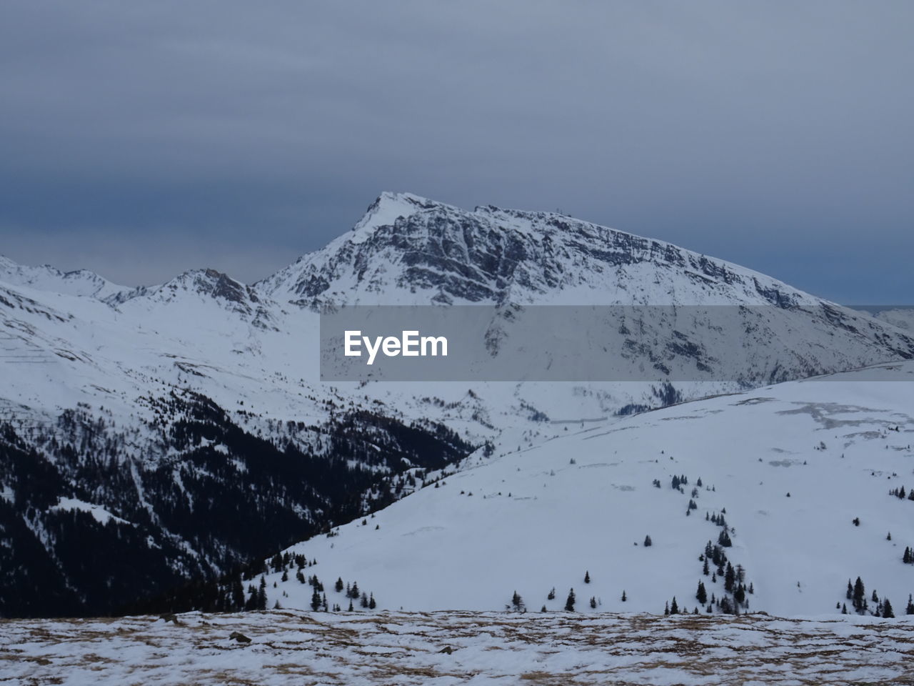 SNOW COVERED MOUNTAIN AGAINST SKY