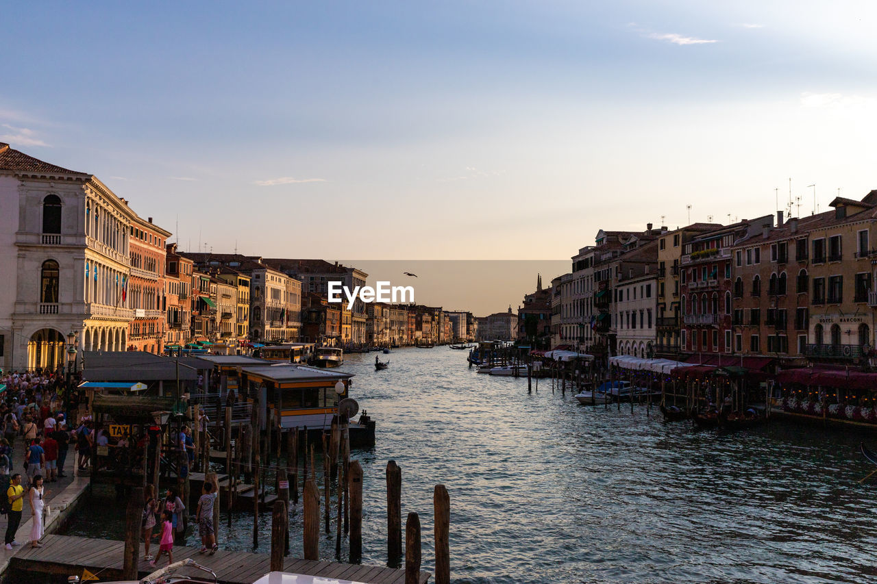 View of buildings in city at sunset