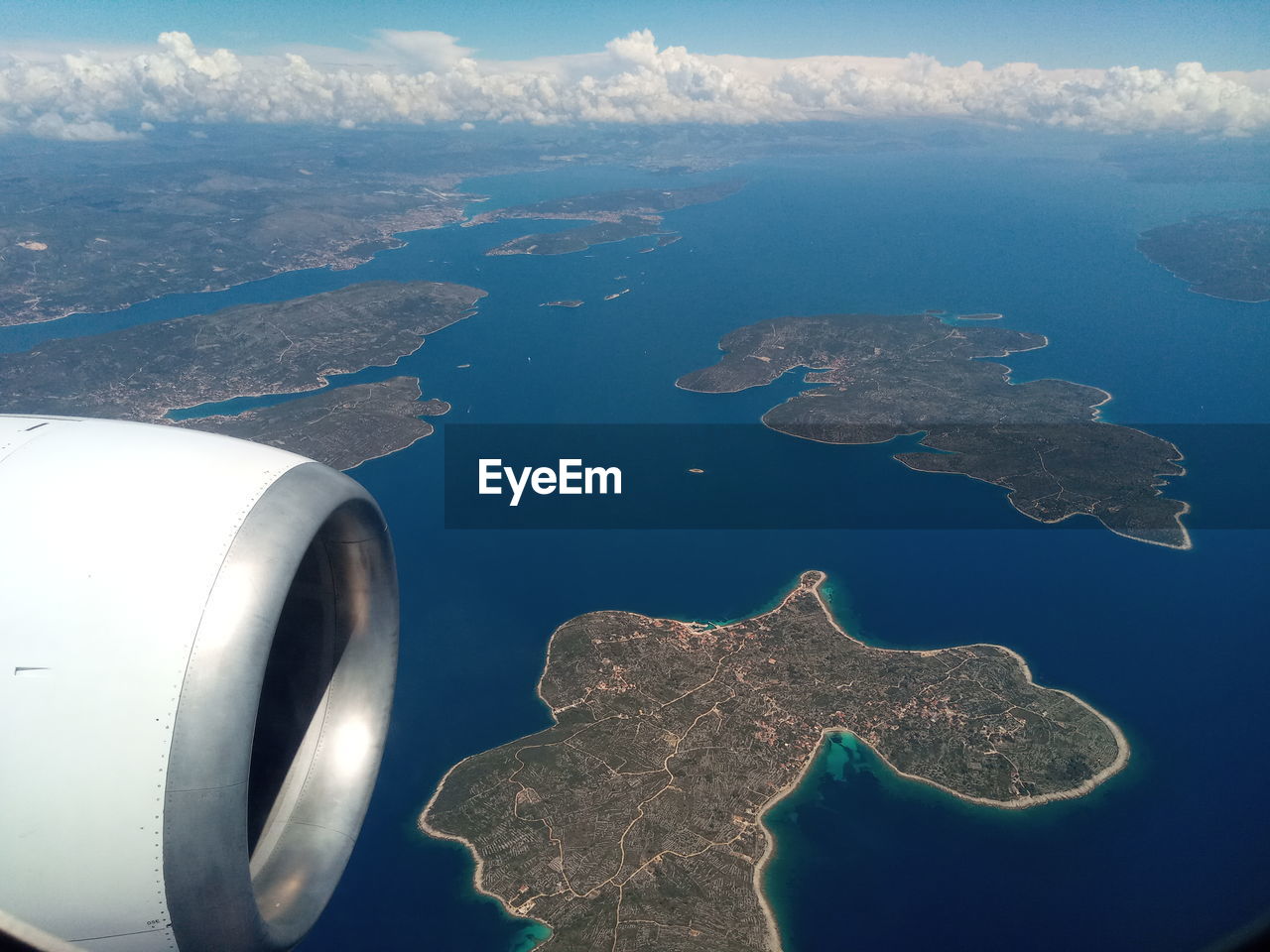 AERIAL VIEW OF SEA SEEN THROUGH AIRPLANE