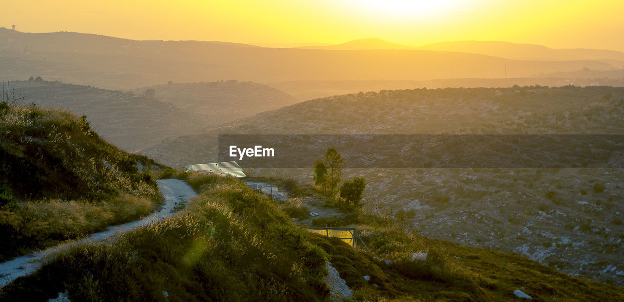 High angle view of mountains against sky during sunset