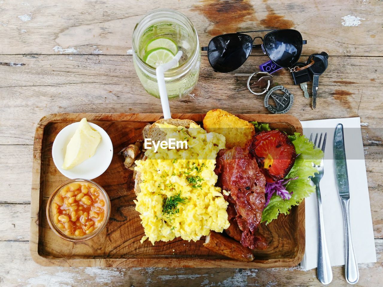 High angle view of meal with sunglasses and keys on table in restaurant