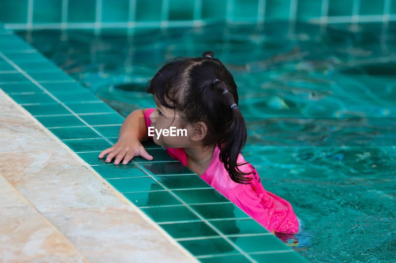 High angle view of girl in swimming pool