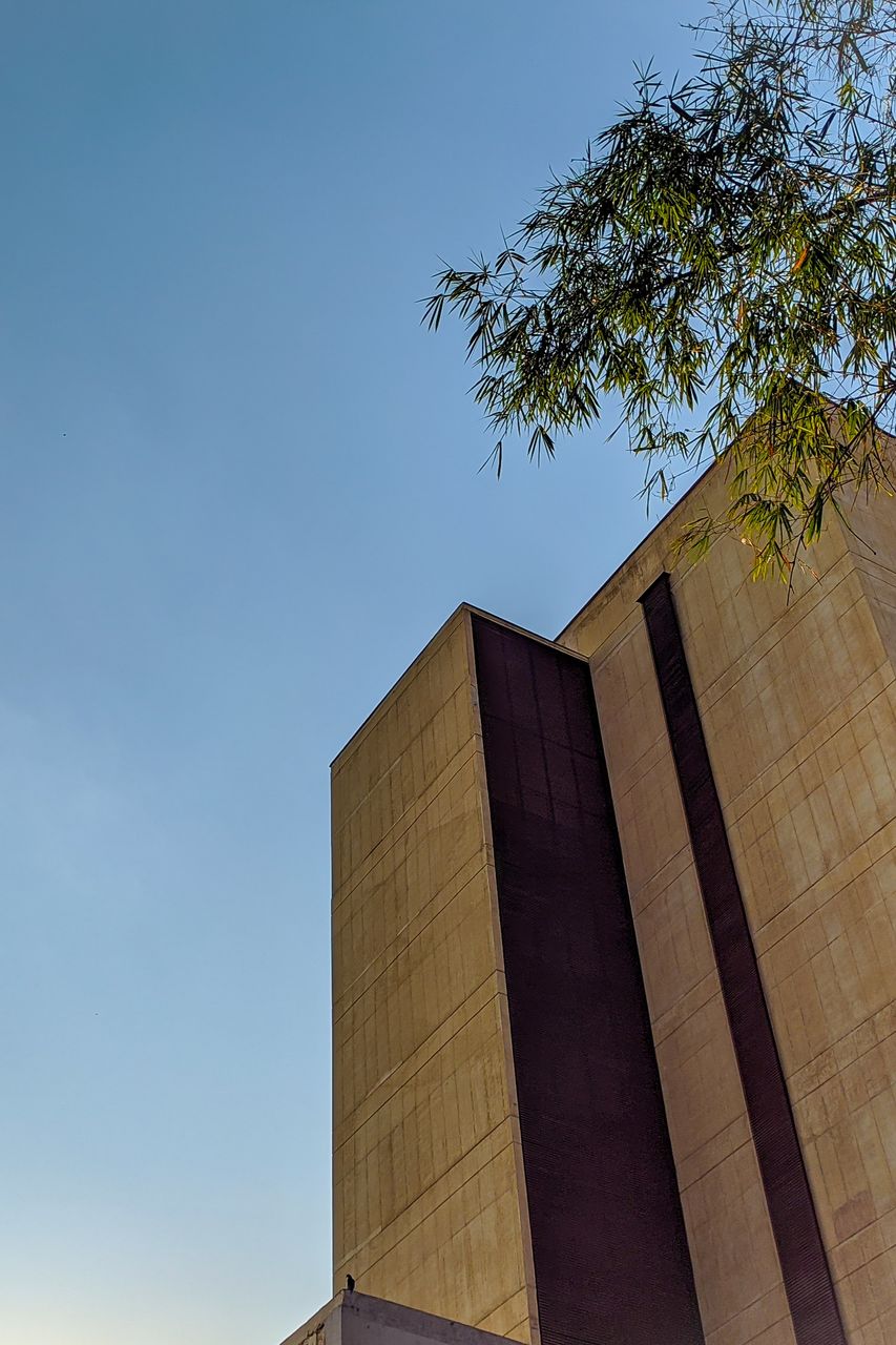 Low angle view of building against clear blue sky