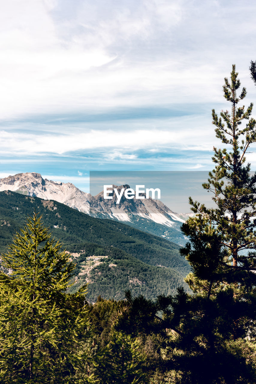 Scenic view of snowcapped mountains against sky