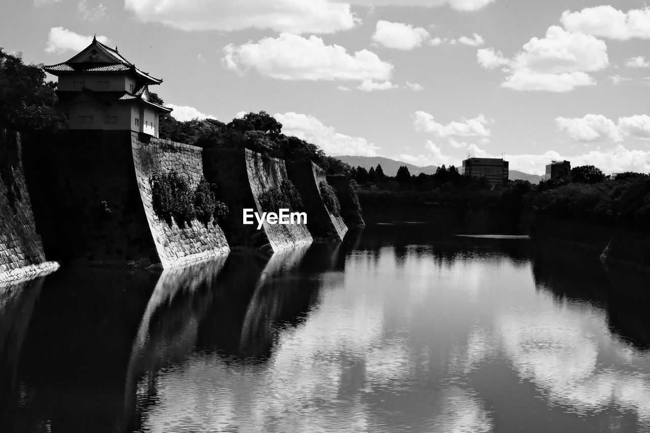 water, reflection, black and white, sky, cloud, architecture, monochrome photography, monochrome, built structure, nature, black, no people, building exterior, travel destinations, river, history, scenics - nature, outdoors, the past, building, day, beauty in nature, environment, tree, travel, tourism, waterway