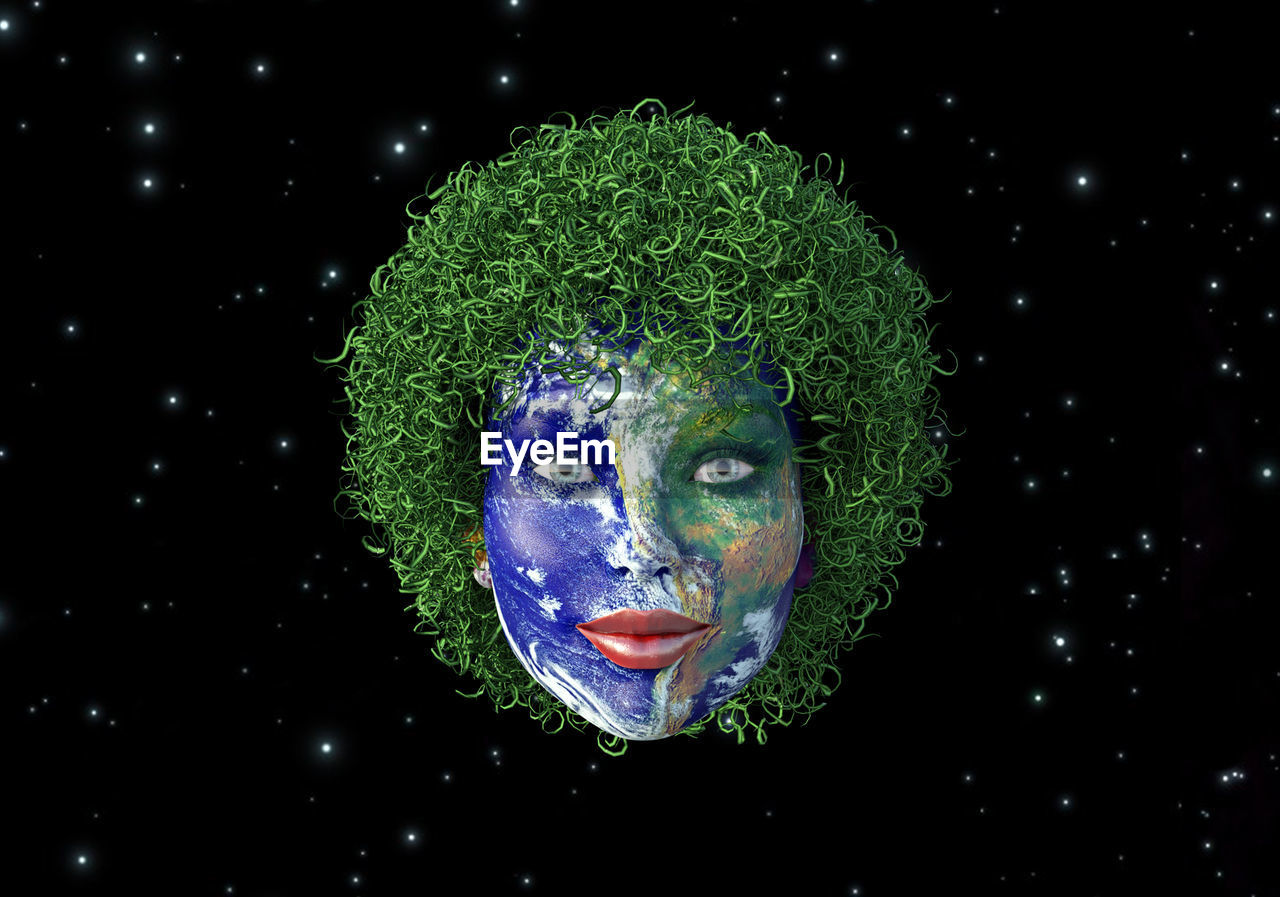 Digital composite image of human face painted as globe against star field