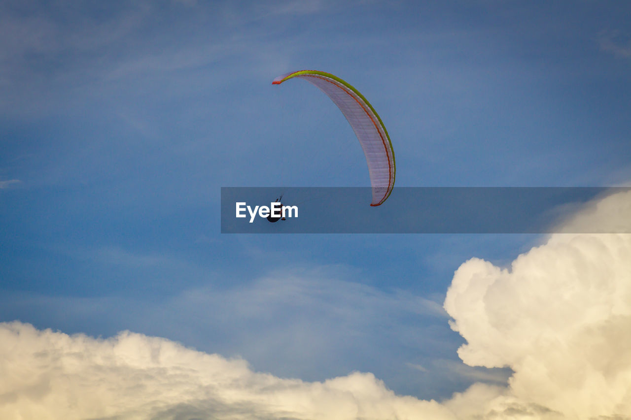 LOW ANGLE VIEW OF PARAGLIDING AGAINST SKY