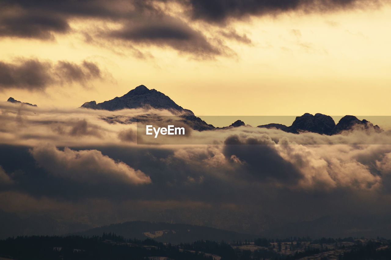 Scenic view of mountains against sky during sunset