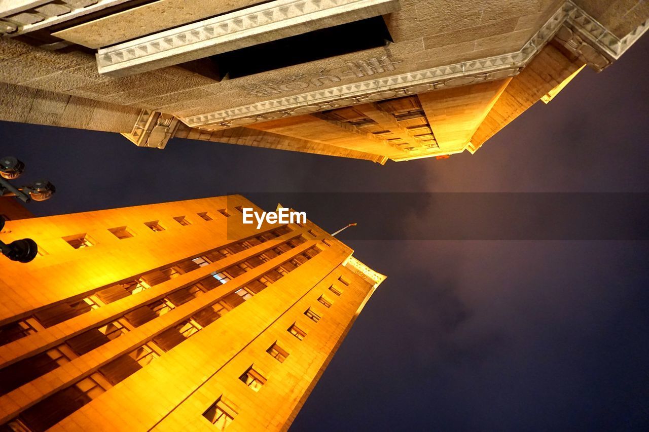 LOW ANGLE VIEW OF YELLOW BUILDING AGAINST SKY