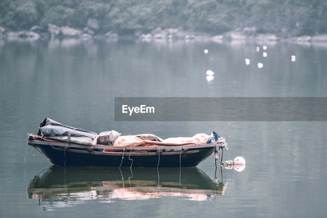 BOAT LYING IN LAKE