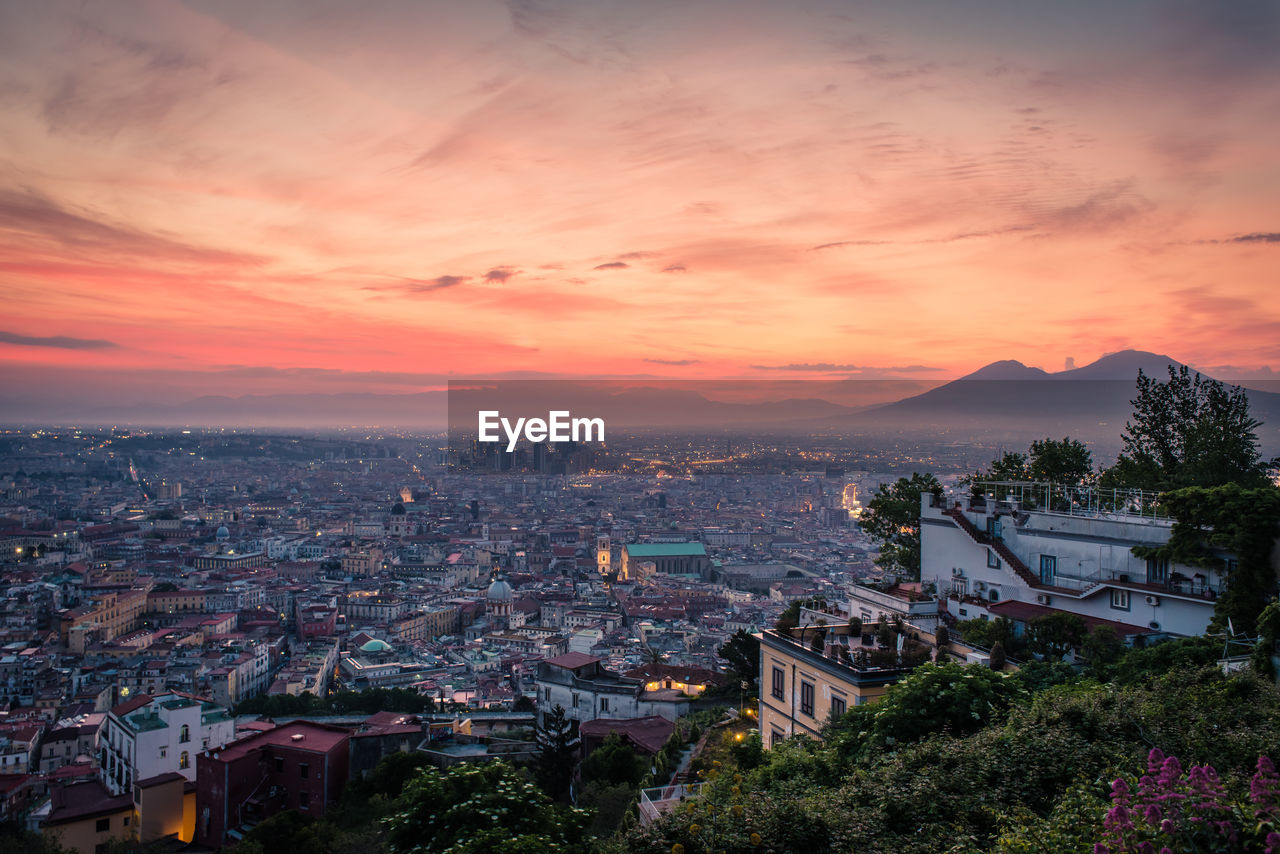 Cityscape against sky during sunset