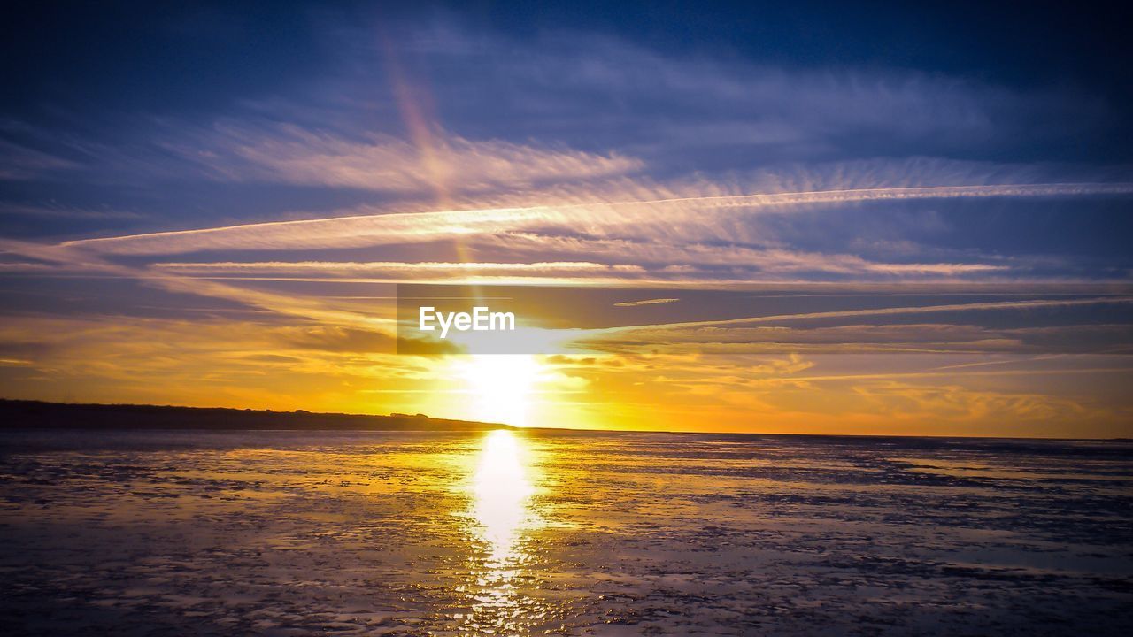 Scenic view of sea against sky during sunset