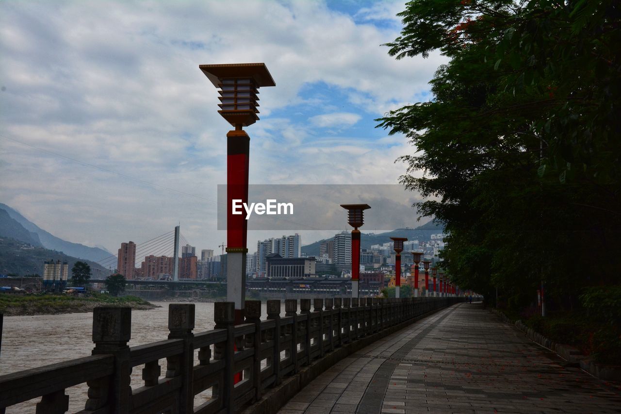 VIEW OF BRIDGE AND BUILDINGS AGAINST SKY