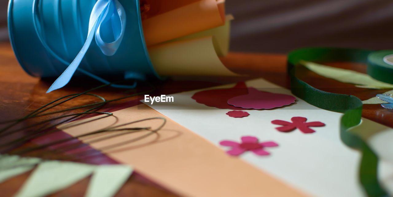 Close-up of colorful papers on table