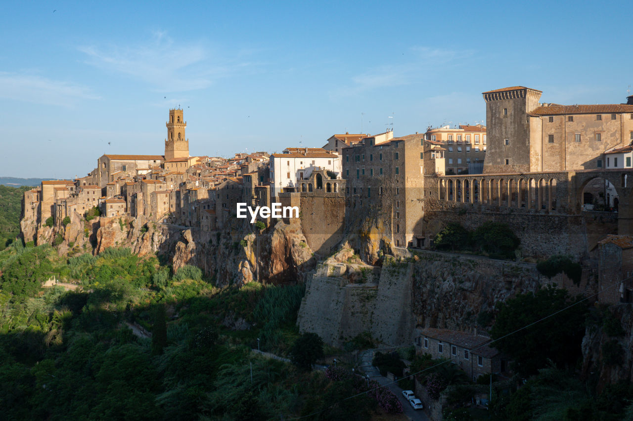 Pitigliano cityscape with buildings in early morning light in tuscany