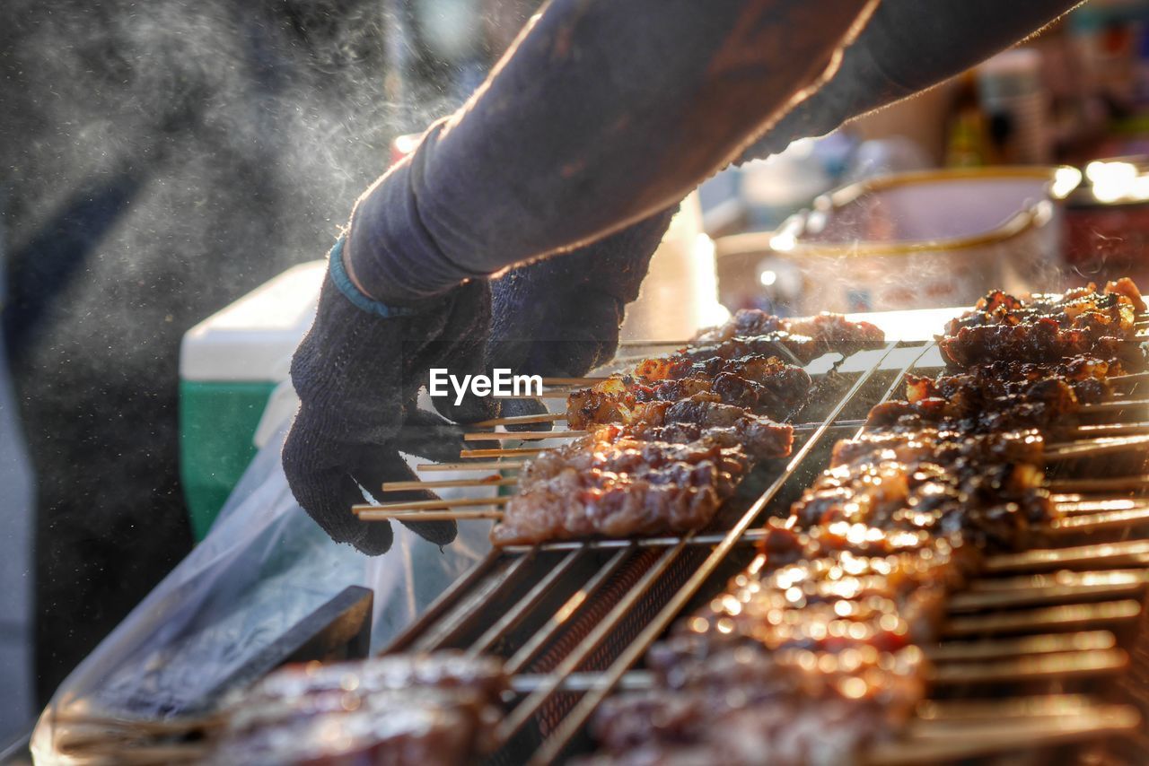 cropped image of man preparing food