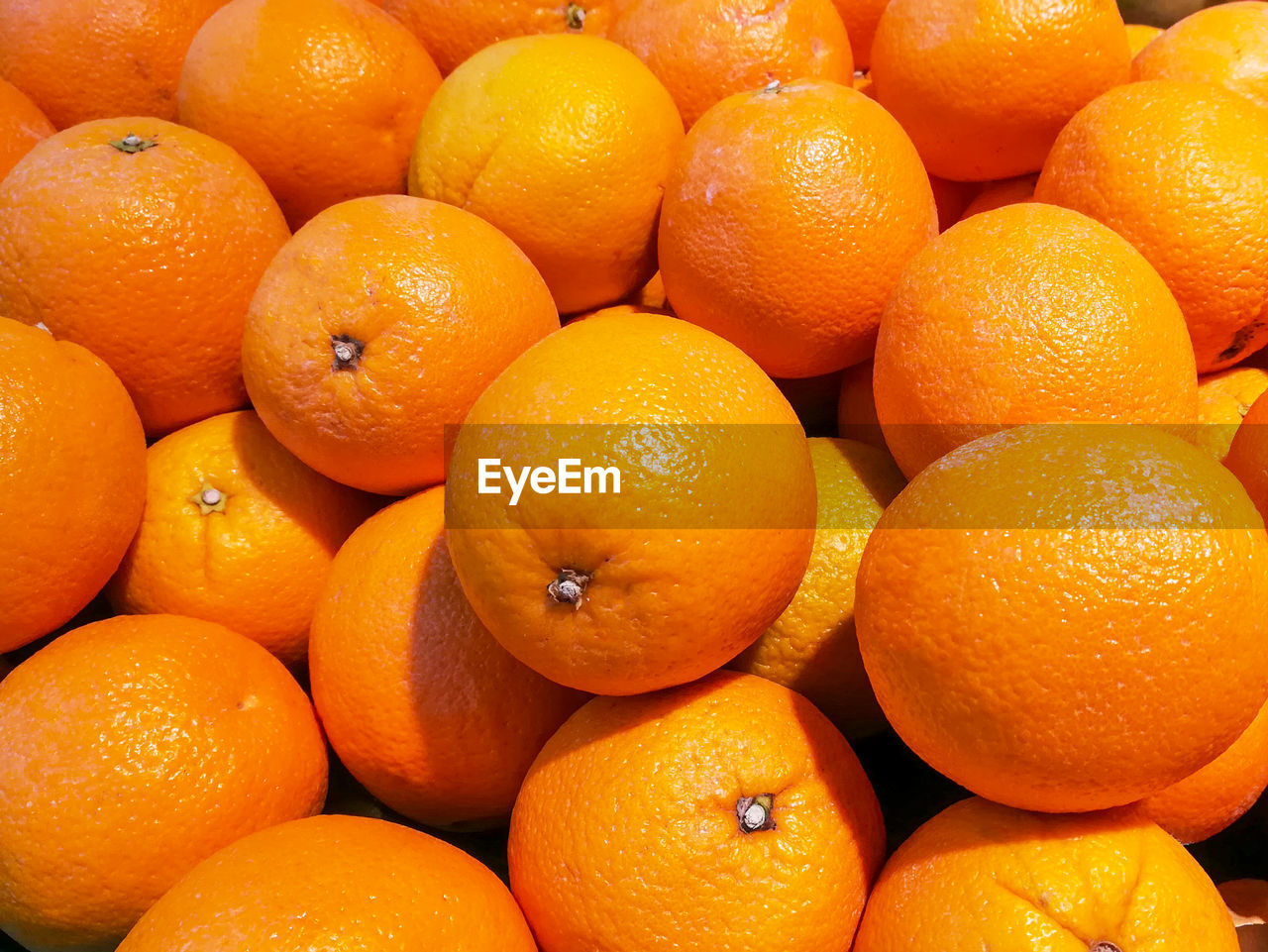 Full frame shot of oranges in market