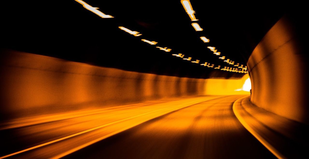 BLURRED MOTION OF LIGHT TRAILS ON ROAD