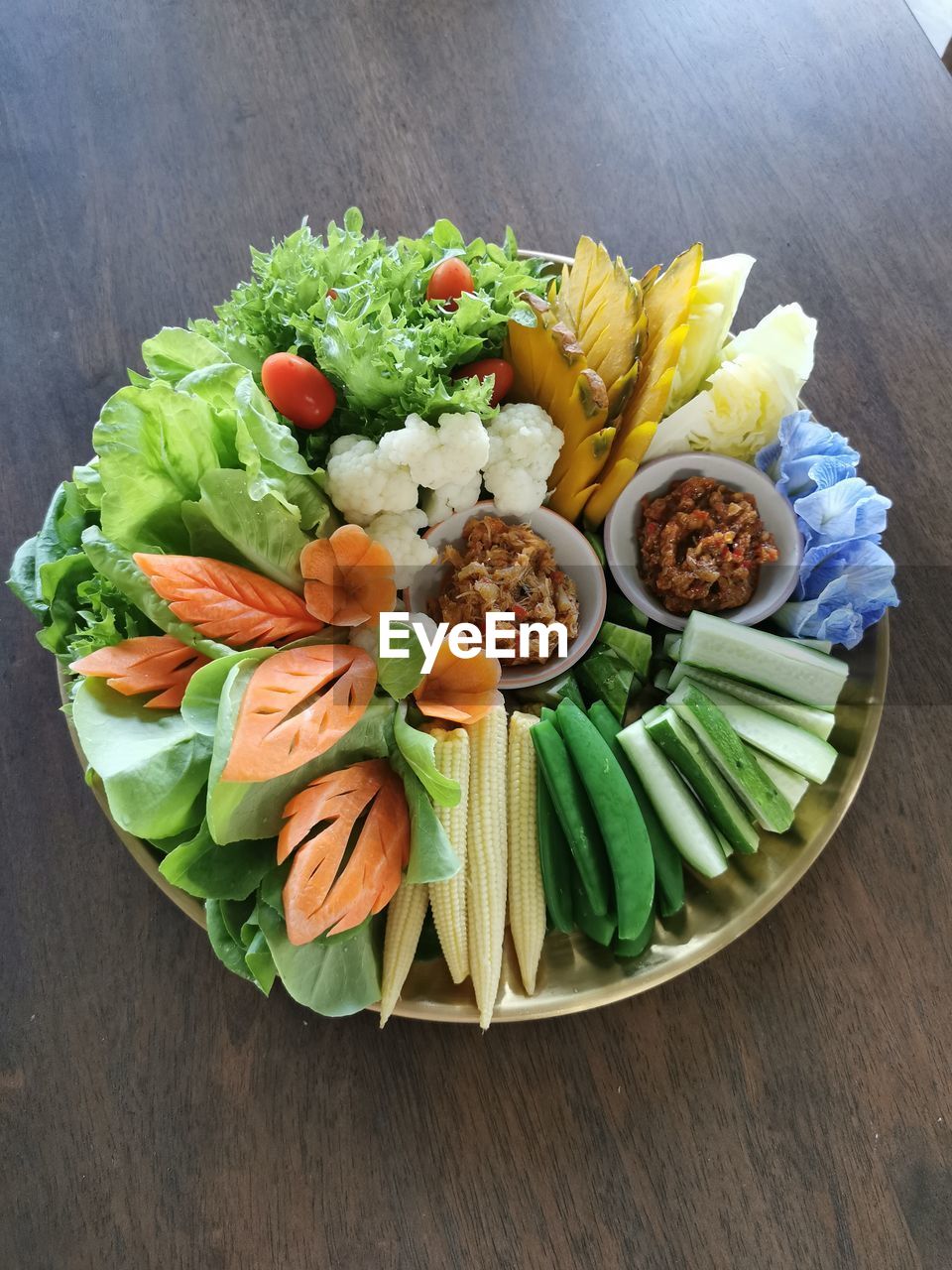 food and drink, food, healthy eating, vegetable, freshness, wellbeing, dish, high angle view, plate, produce, no people, flower, indoors, table, cuisine, platter, salad, fruit, meal, still life, lettuce, studio shot, wood, variation, meat