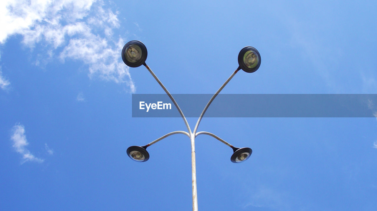 Low angle view of street light against sky