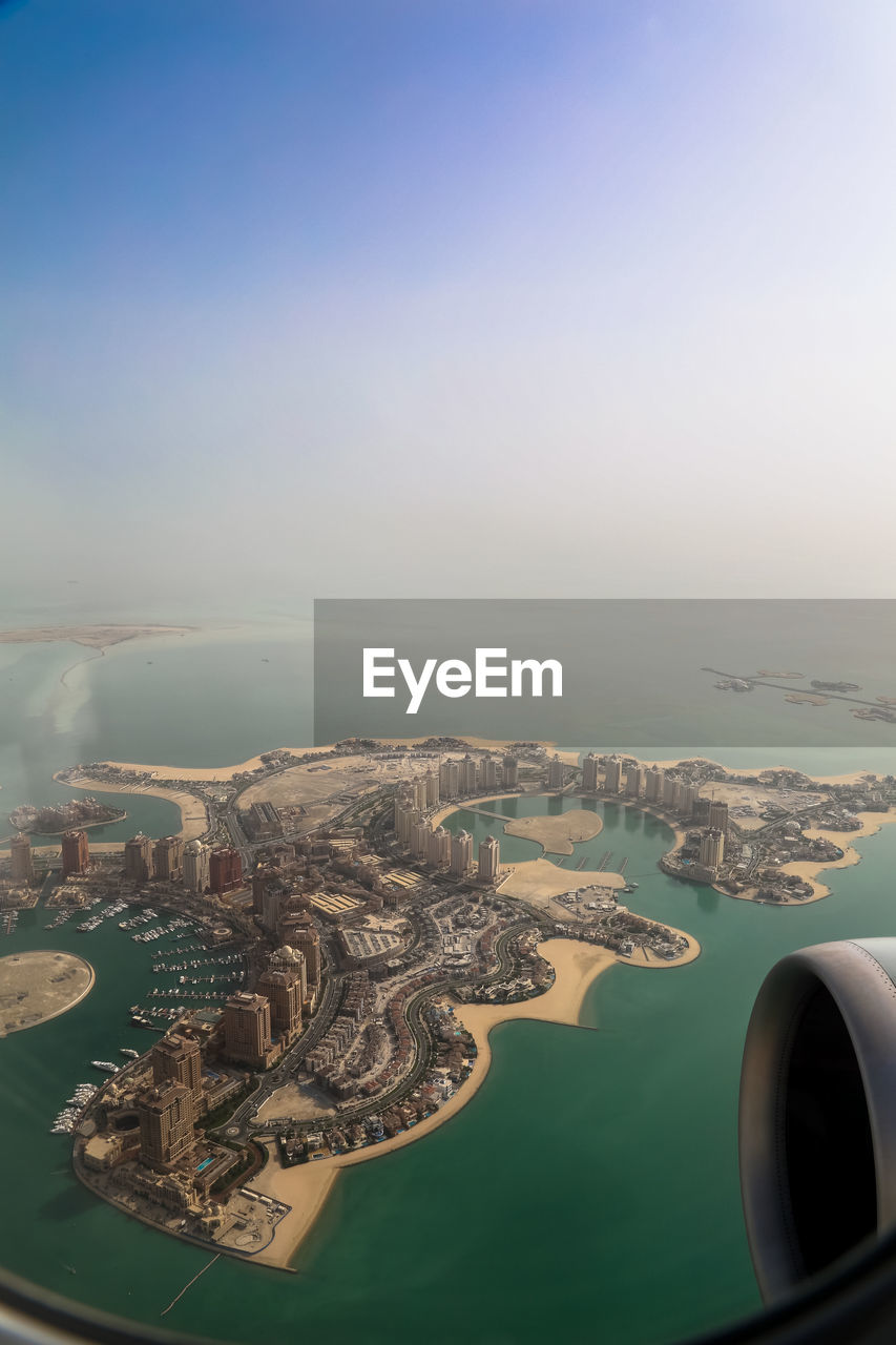 AERIAL VIEW OF CITYSCAPE AND AIRPLANE