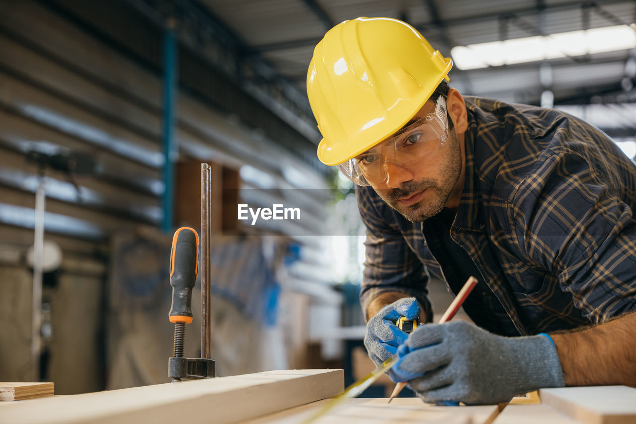 side view of man working in workshop