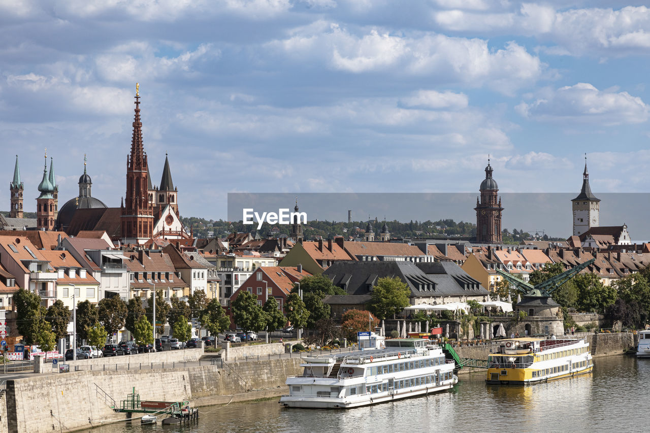 Germany, bavaria, wurzburg, river main and surrounding old town buildings