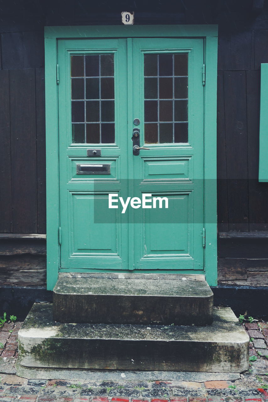 CLOSED BLUE DOOR OF HOUSE