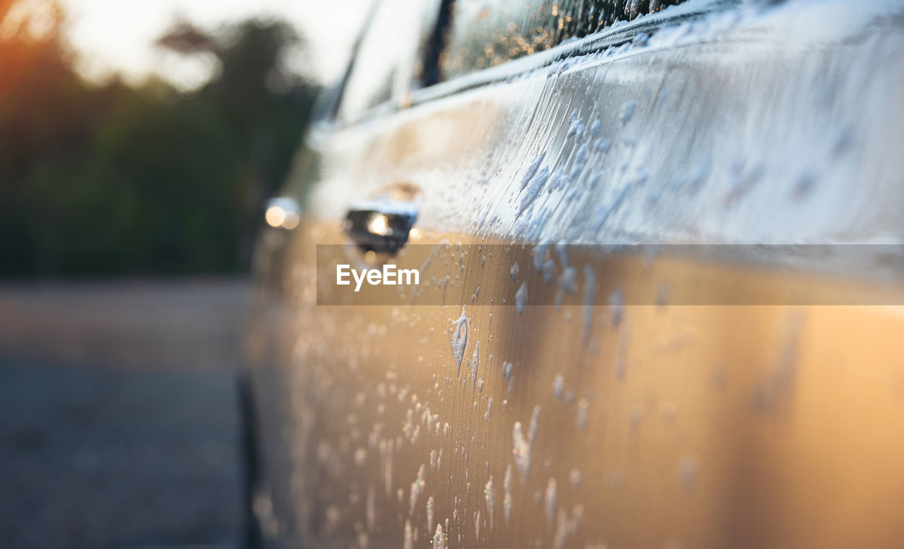 Close-up of wet car outdoors